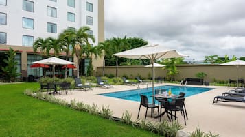 Outdoor pool, pool umbrellas, sun loungers