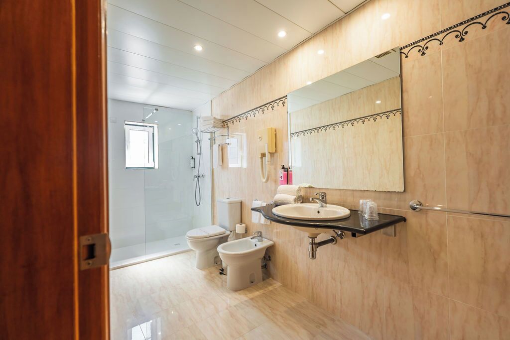 deep-soaking bathtub, free toiletries, hair dryer, bidet