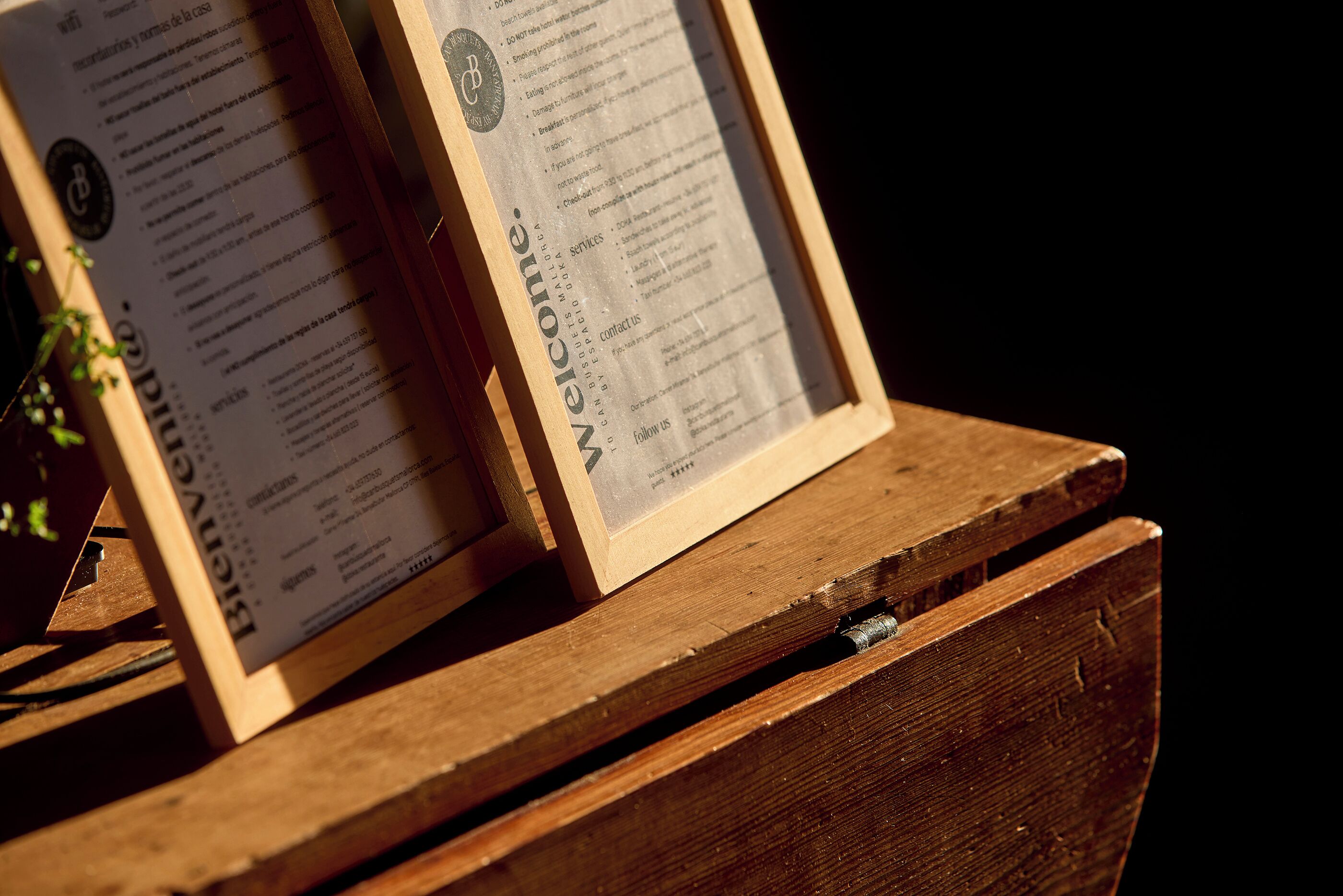 A wooden chest with a menu card attached to it.