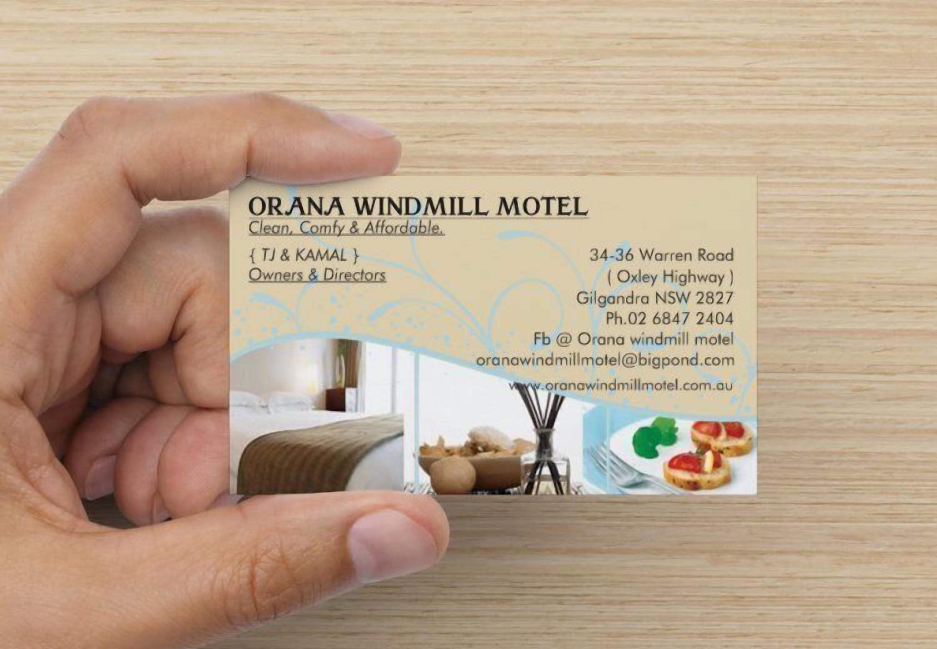 A business card for Orana Windmill Motel, including the address, phone number, and website.