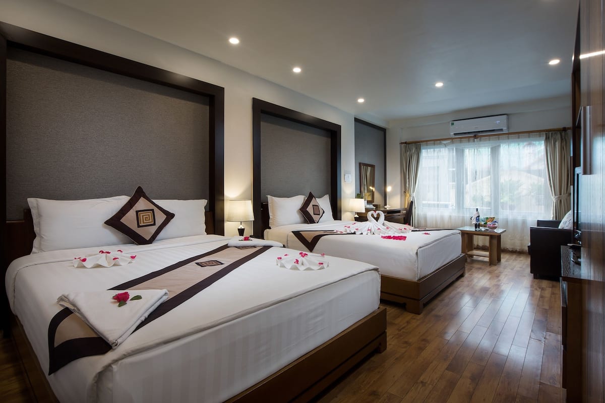 Family Room, 2 Queen Beds, City View | Pillow-top beds, minibar, in-room safe, individually decorated