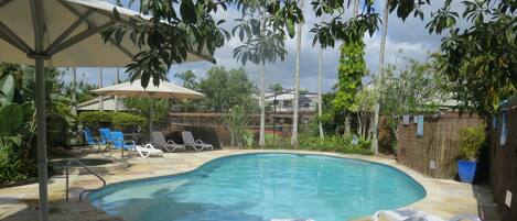 Outdoor pool, a heated pool, pool umbrellas, pool loungers