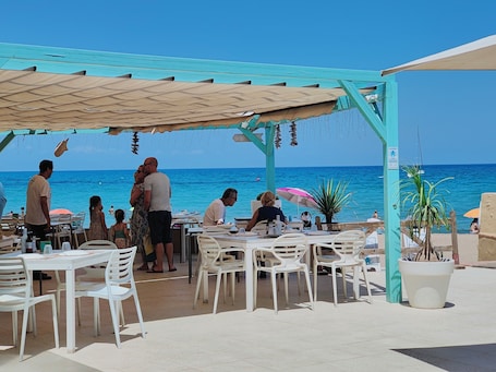 Breakfast, lunch, dinner served; Spanish cuisine, beach views