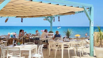Breakfast, lunch, dinner served; Spanish cuisine, beach views