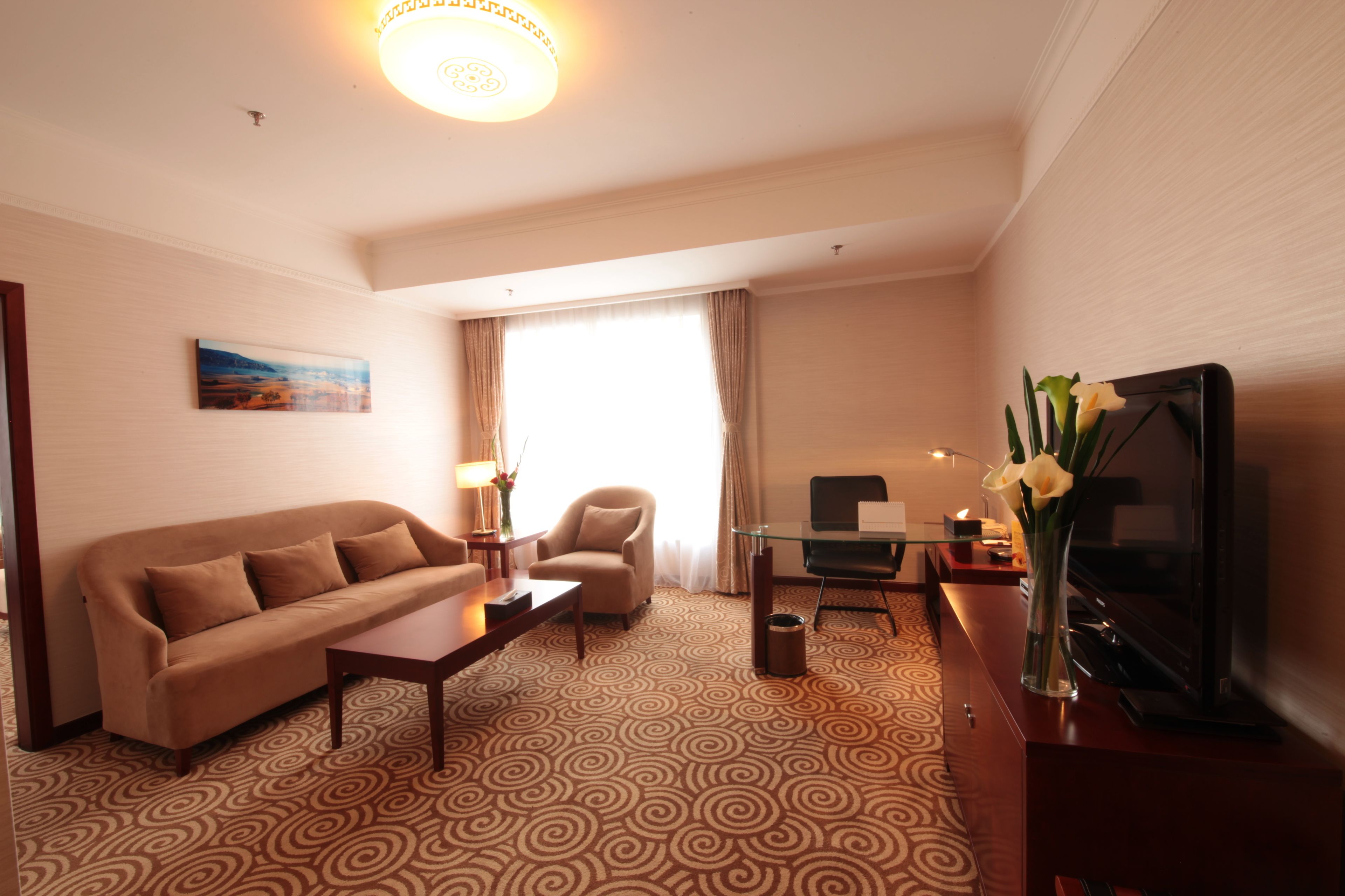 deluxe suite | premium bedding, down duvets, minibar, in-room safe