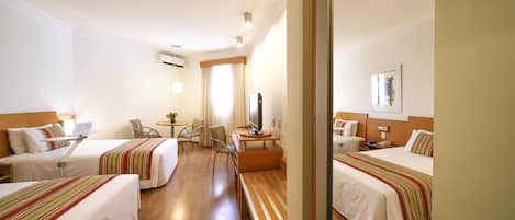 Deluxe Twin Room | Minibar, in-room safe, desk, blackout curtains