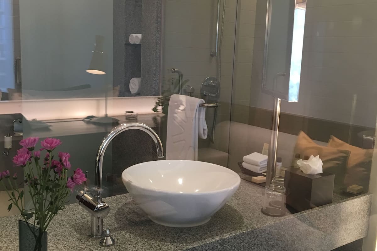 rainfall showerhead, designer toiletries, hair dryer, bathrobes