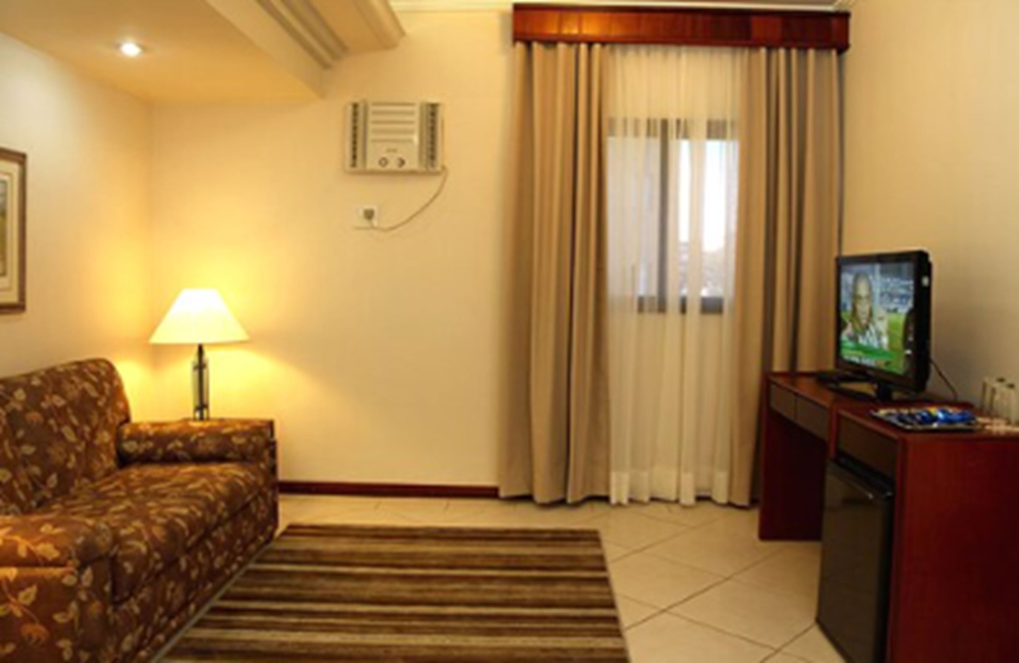premium suite | living room | 42-inch flat-screen tv with cable channels, tv