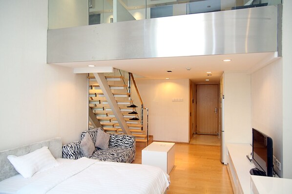 Suite superior | Edredón, tabla de planchar con plancha, camas extra y wifi gratis