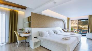 Deluxe Room, Sea View | 1 bedroom, premium bedding, minibar, in-room safe