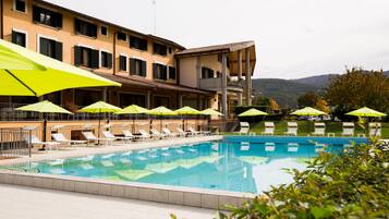 Outdoor pool, open 9:00 AM to 7:00 PM, pool umbrellas, sun loungers
