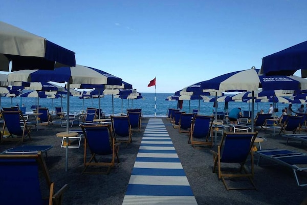 On the beach, sun loungers, beach umbrellas, beach volleyball