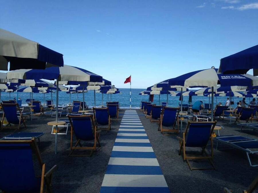 On the beach, sun-loungers, beach umbrellas, beach volleyball