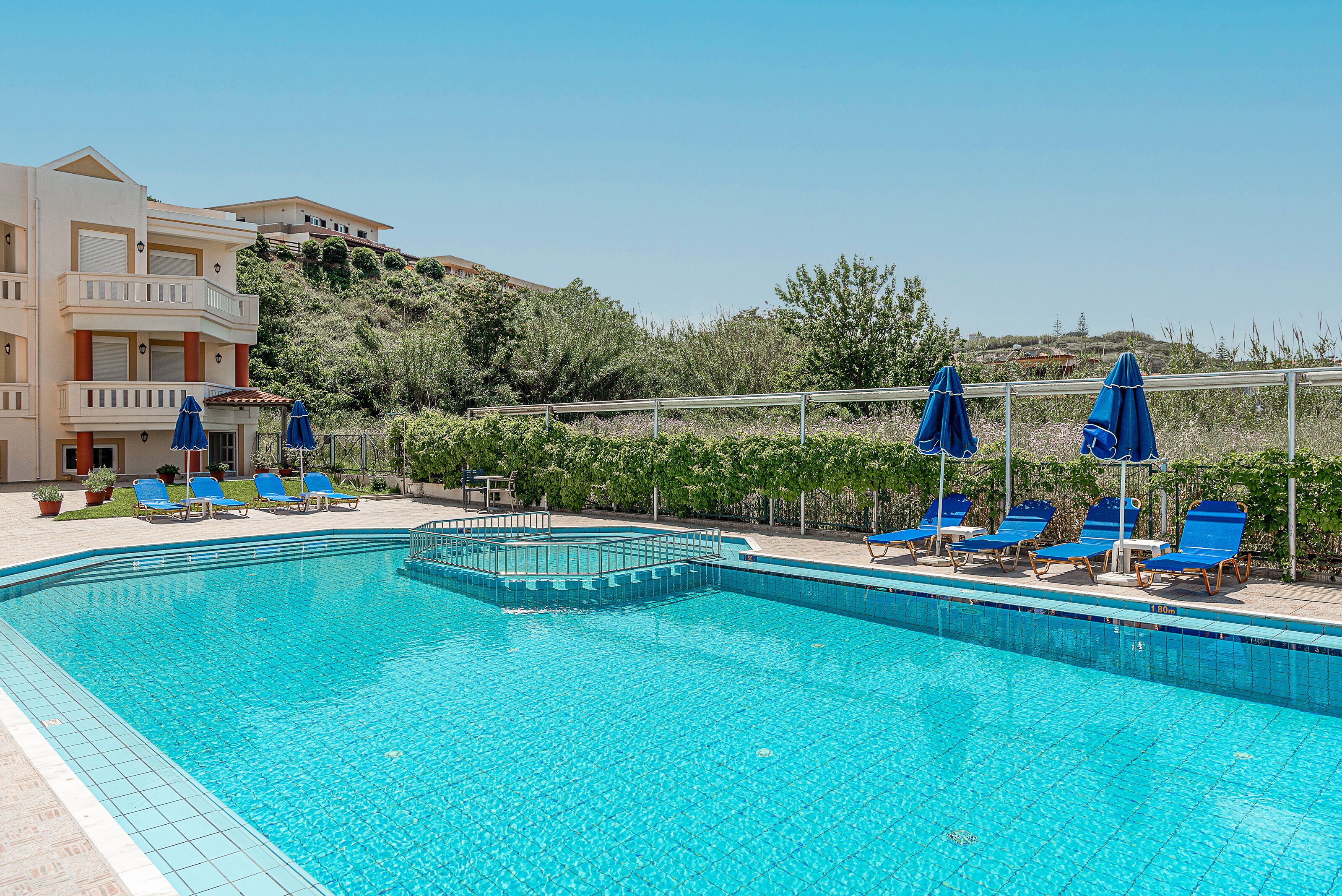 Outdoor pool, open 9:00 AM to 8:00 PM, pool umbrellas, pool loungers