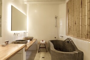 Designer toiletries, hair dryer, bathrobes, slippers