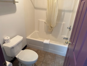 Room, 2 Double Beds | Bathroom | Combined shower/tub, free toiletries, hair dryer, towels