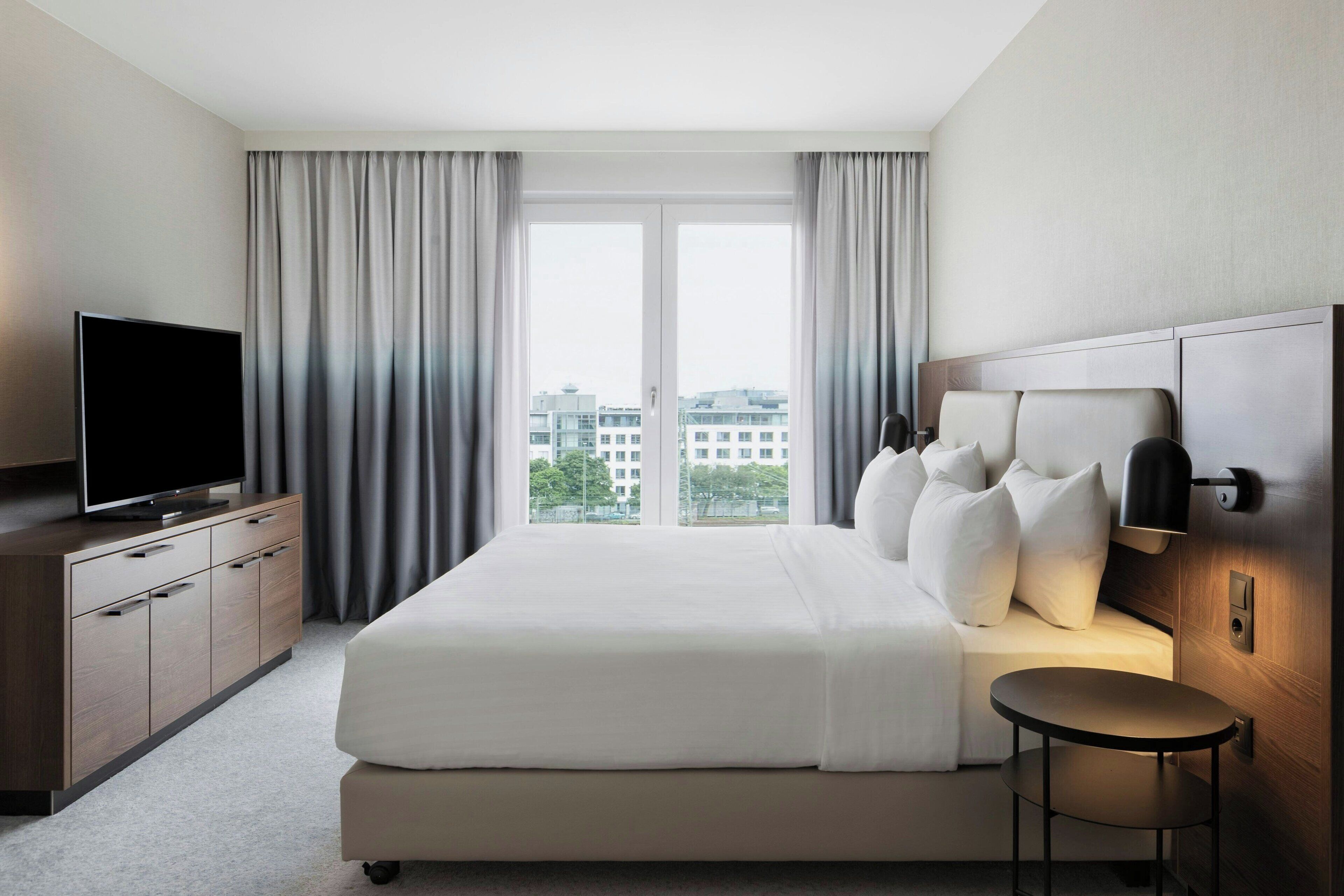 grand suite, 1 bedroom, city view | 1 bedroom, premium bedding, pillow-top beds, in-room safe
