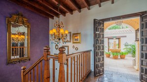 A wooden staircase with a railing leading to an open doorway. - LA TARTANA HOTEL BOUTIQUE (Almunecar)