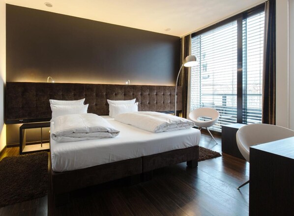 Hypo-allergenic bedding, pillow-top beds, in-room safe, desk