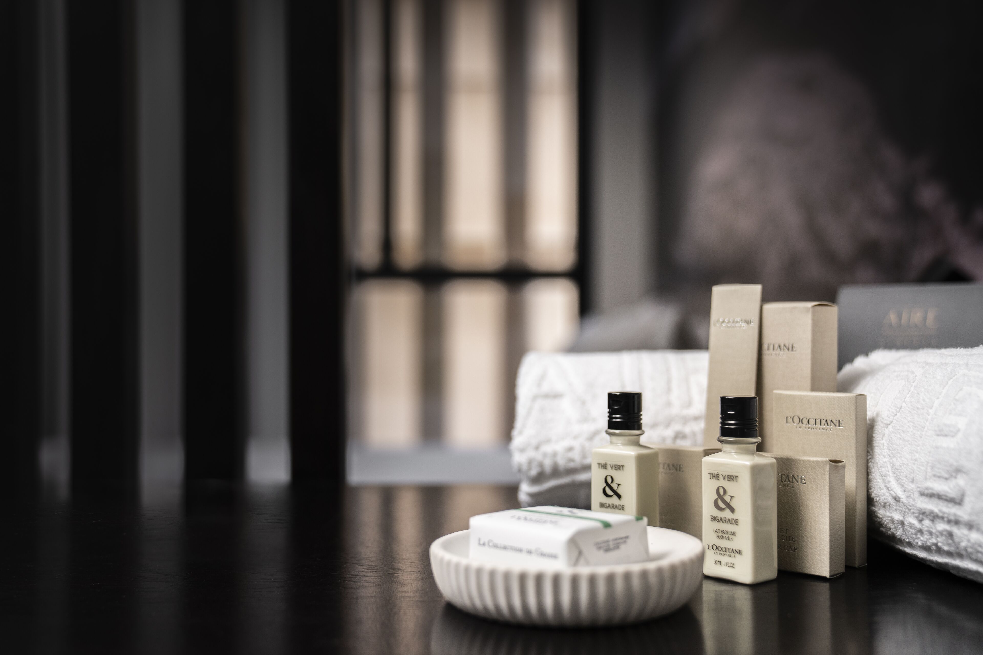 deep-soaking bathtub, rainfall showerhead, designer toiletries