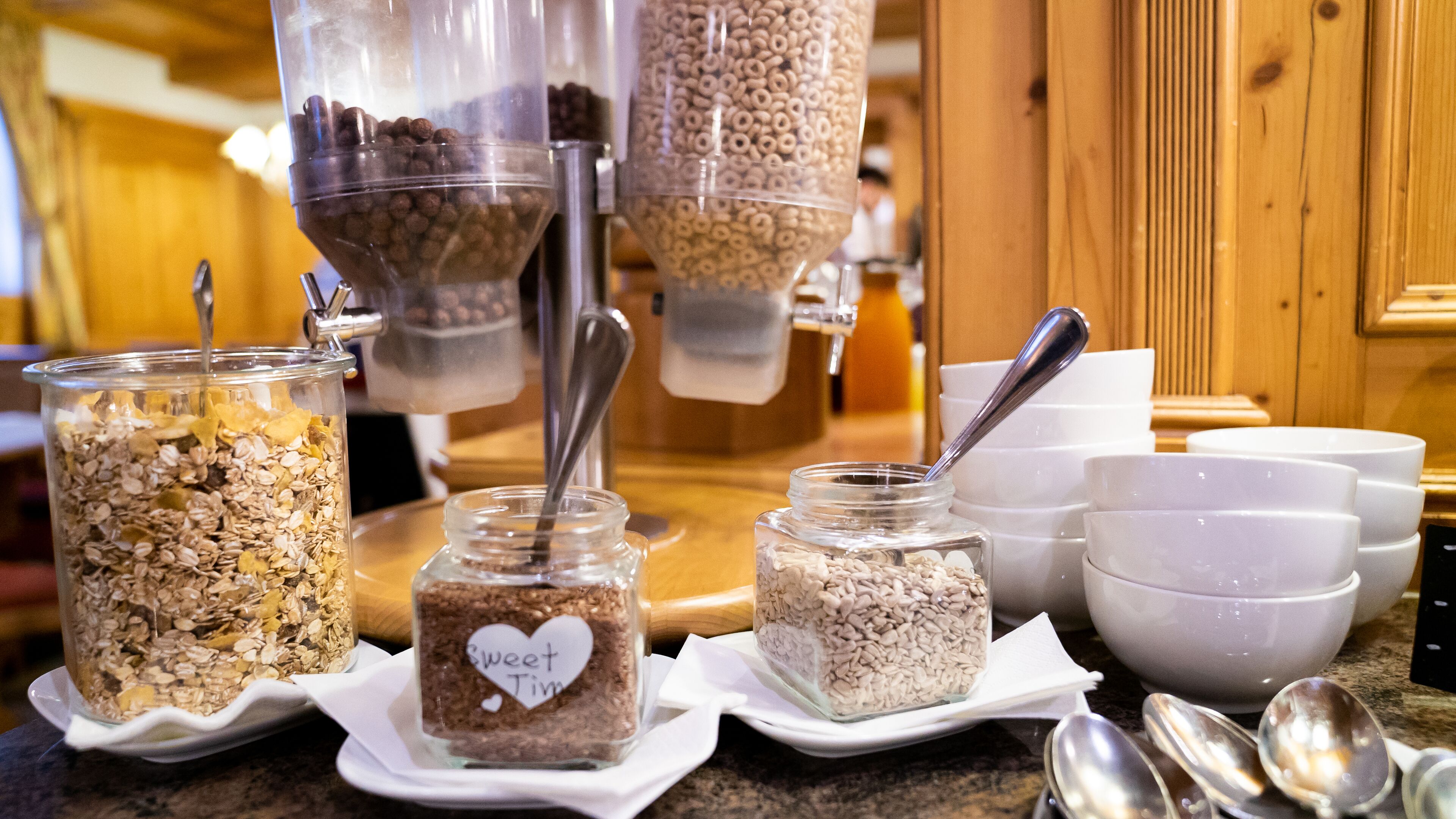 A breakfast buffet with various food items and containers.