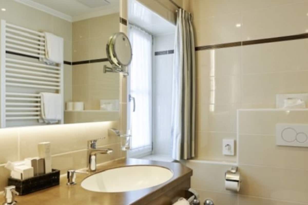junior suite | bathroom | hair dryer, bathrobes, towels