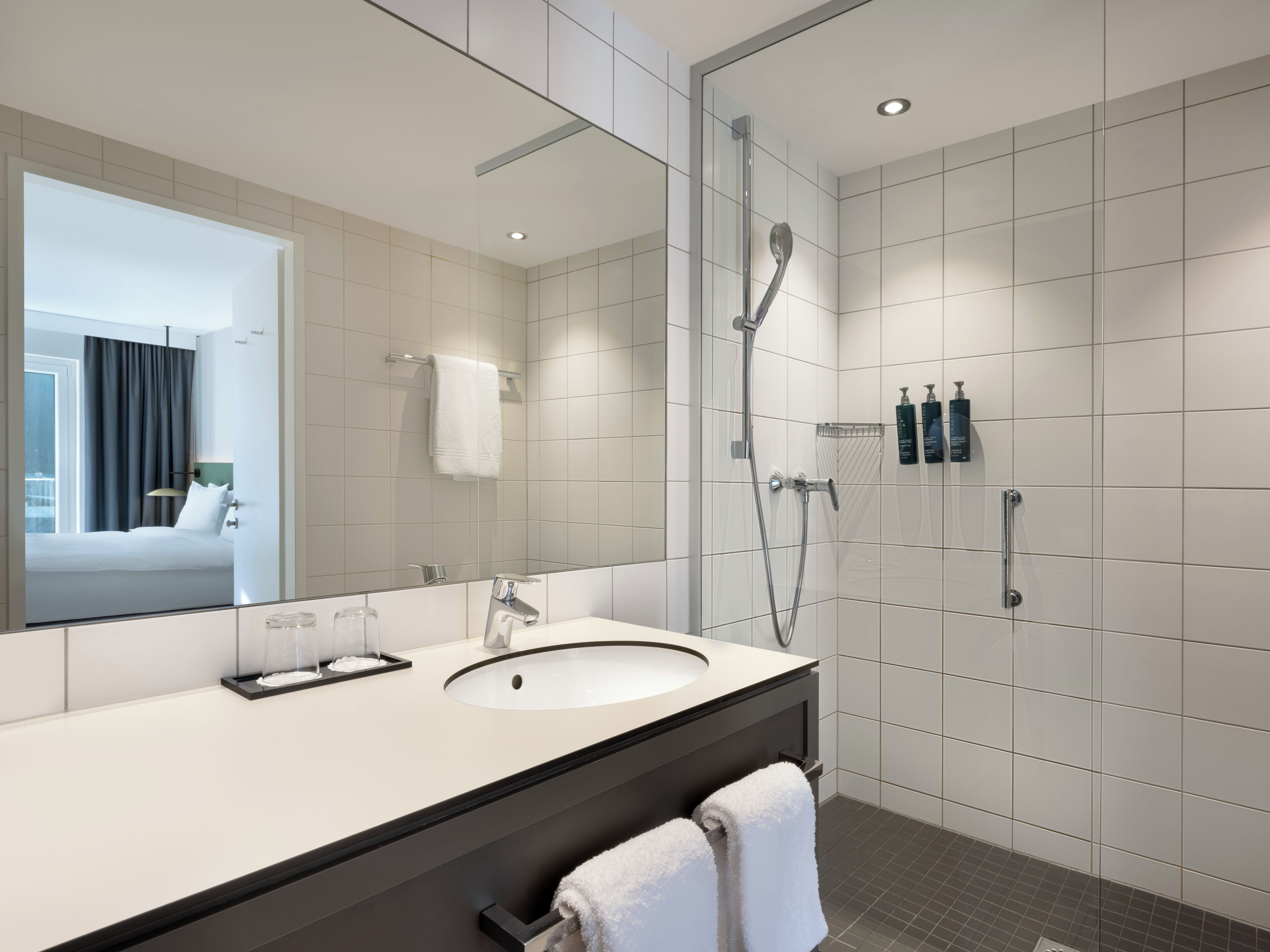 deluxe room, 1 king bed with sofa bed, corner | bathroom | free toiletries, hair dryer, towels