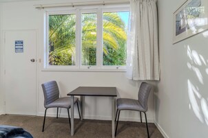 Studio Suite | Living area | 32-inch flat-screen TV with digital channels, TV