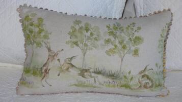 A pillow with a nature scene.