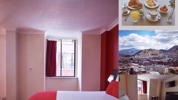 A hotel room with a bed, a window with curtains, a flat-screen TV, and a view of a cityscape. - Hotel Mediterráneo Quito (Quito)