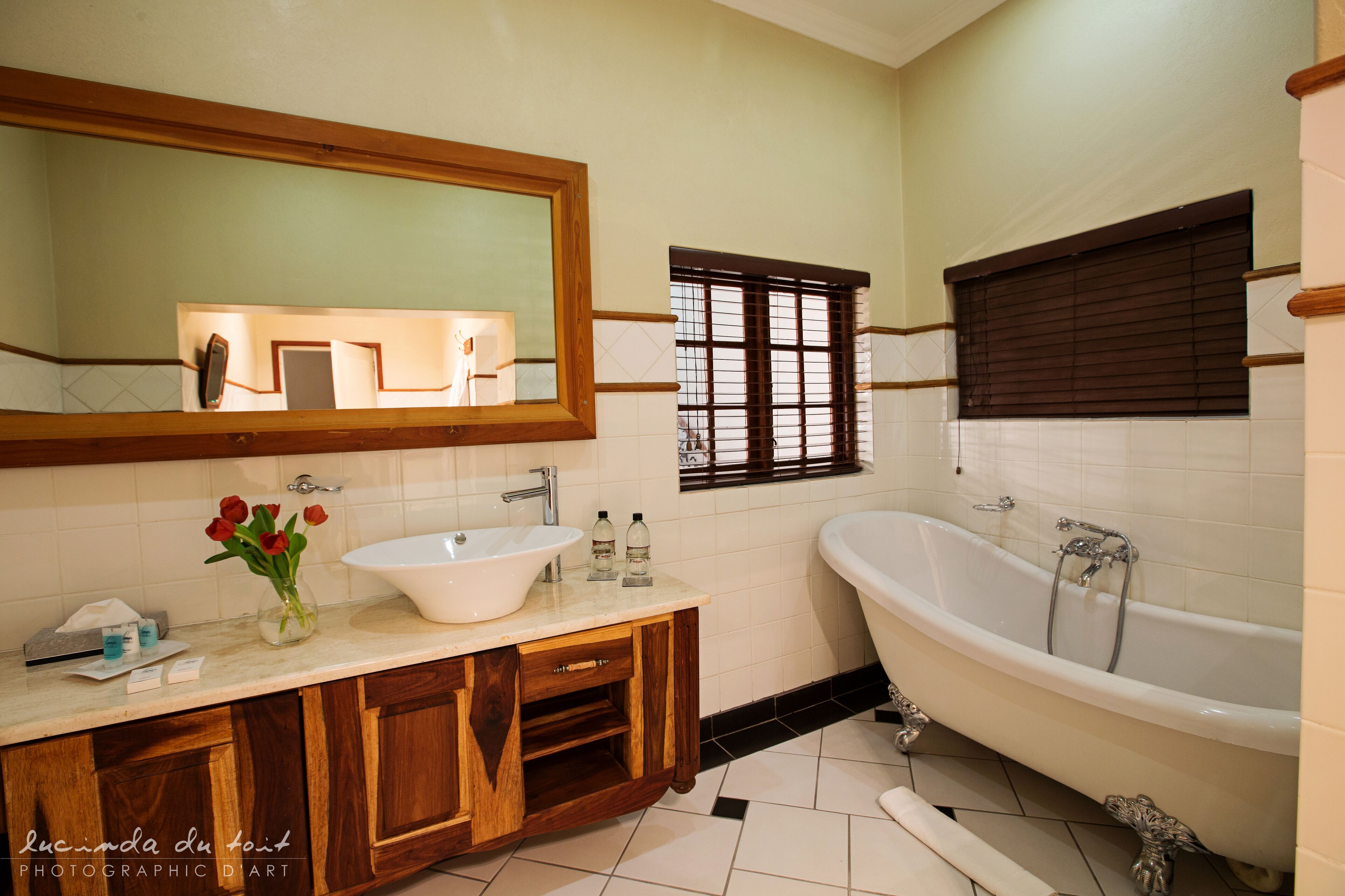 separate bathtub and shower, deep-soaking bathtub, designer toiletries