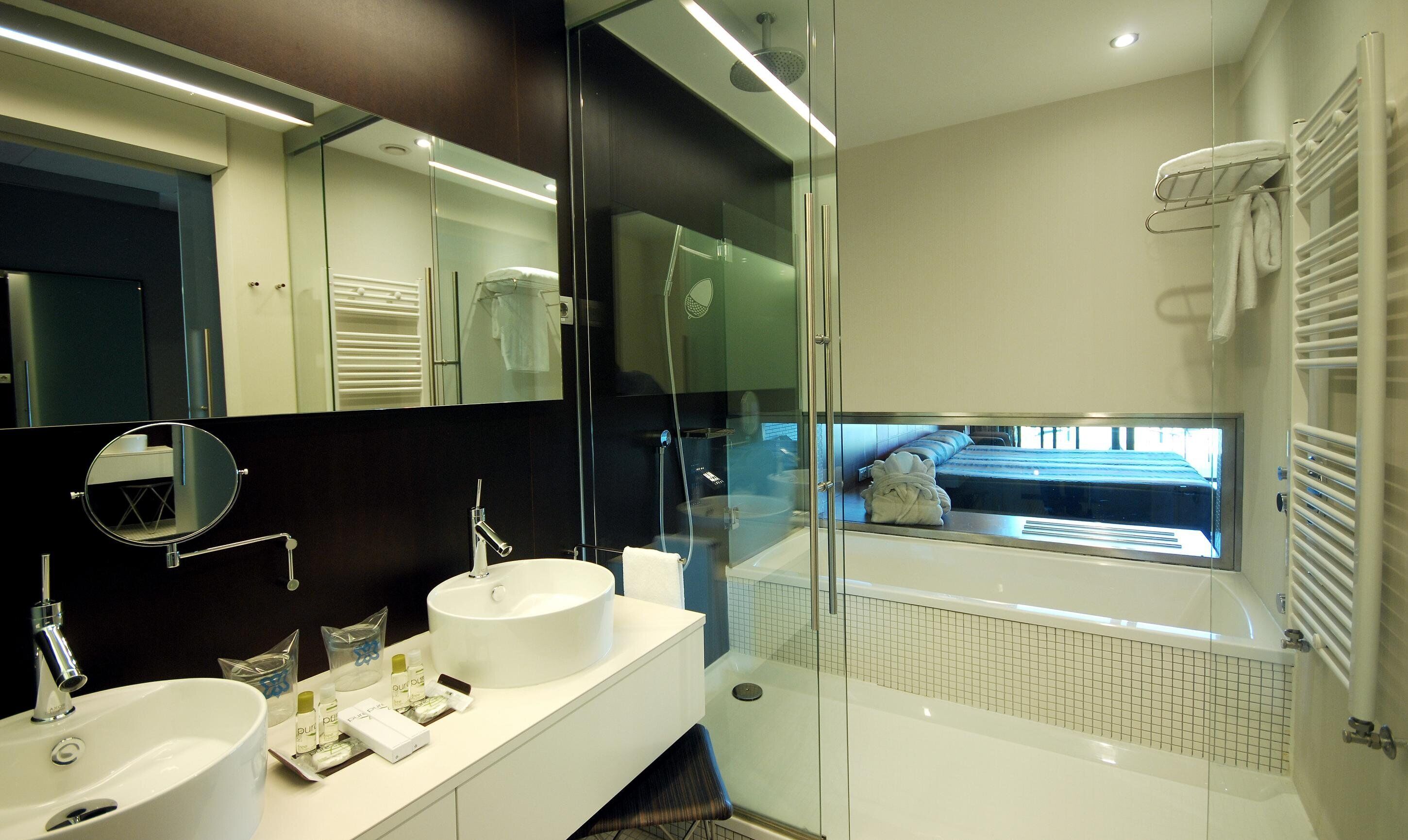 superior room | bathroom | rainfall showerhead, free toiletries, hair dryer, bathrobes
