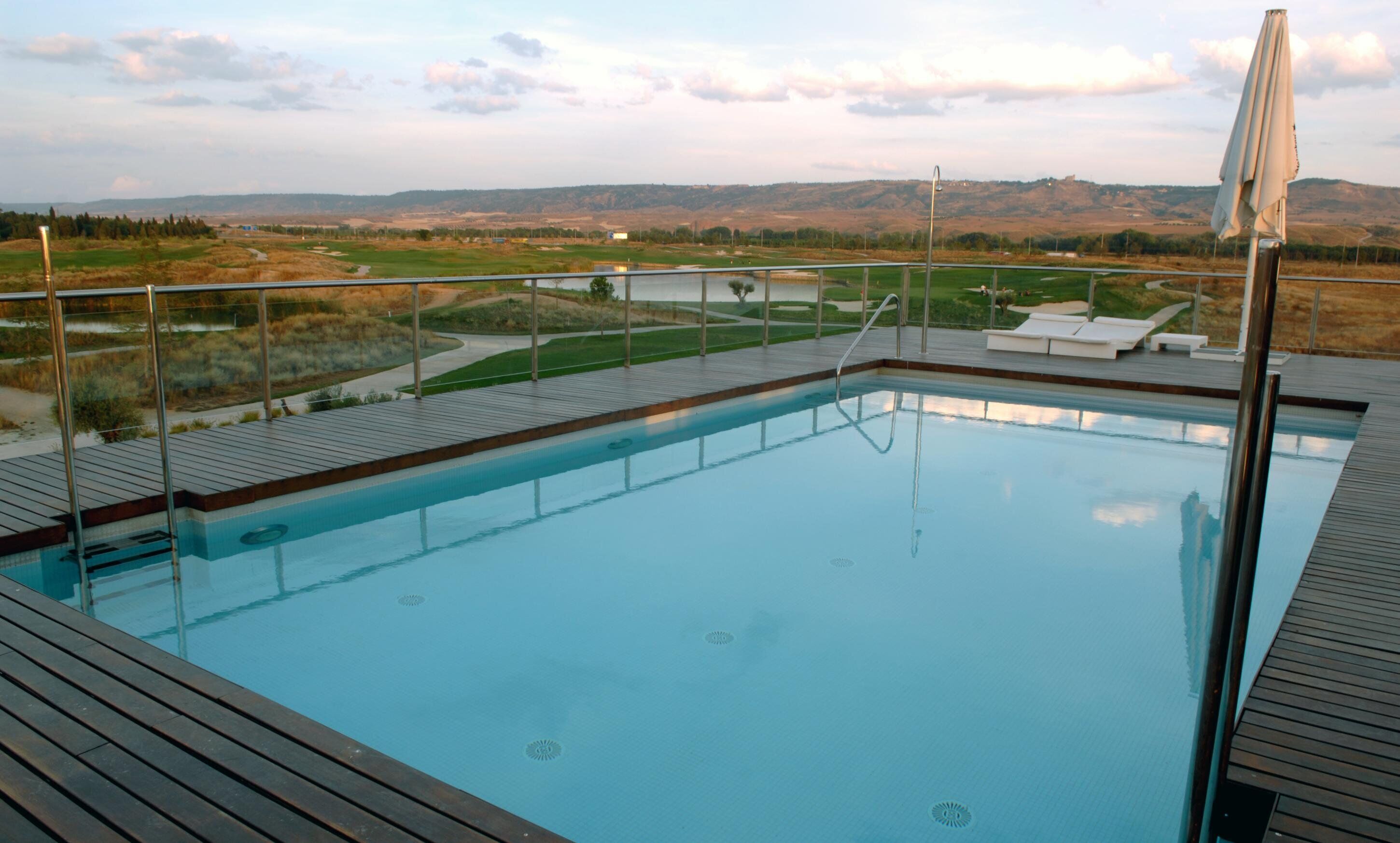 seasonal outdoor pool, open noon to 8:00 pm, pool umbrellas