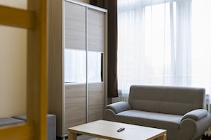 6 Person Apartment | Living area | 32-inch flat-screen TV with digital channels, TV