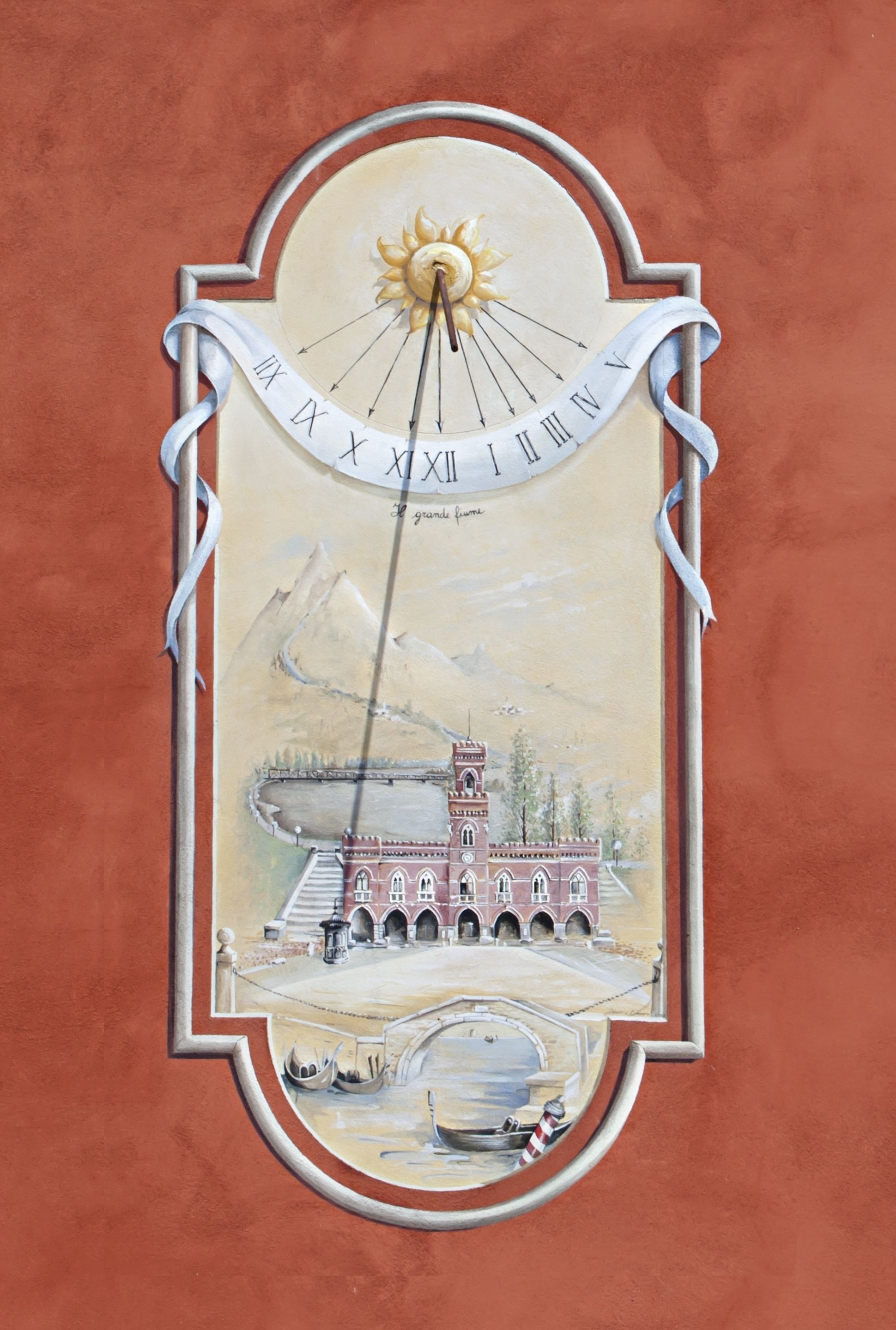 A wall clock with a sun motif, Roman numerals, and a bridge illustration.
