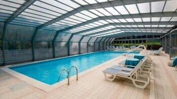 Indoor pool, outdoor pool, pool umbrellas