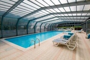 Indoor pool, outdoor pool, pool umbrellas