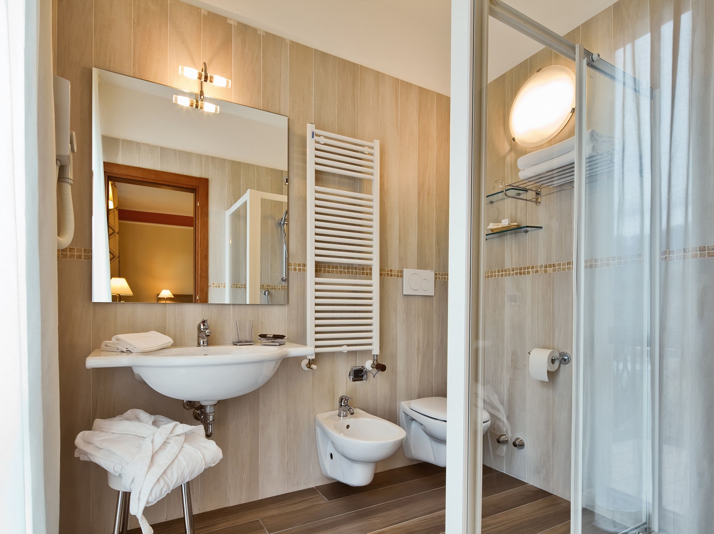 shower, hair dryer, bidet, towels