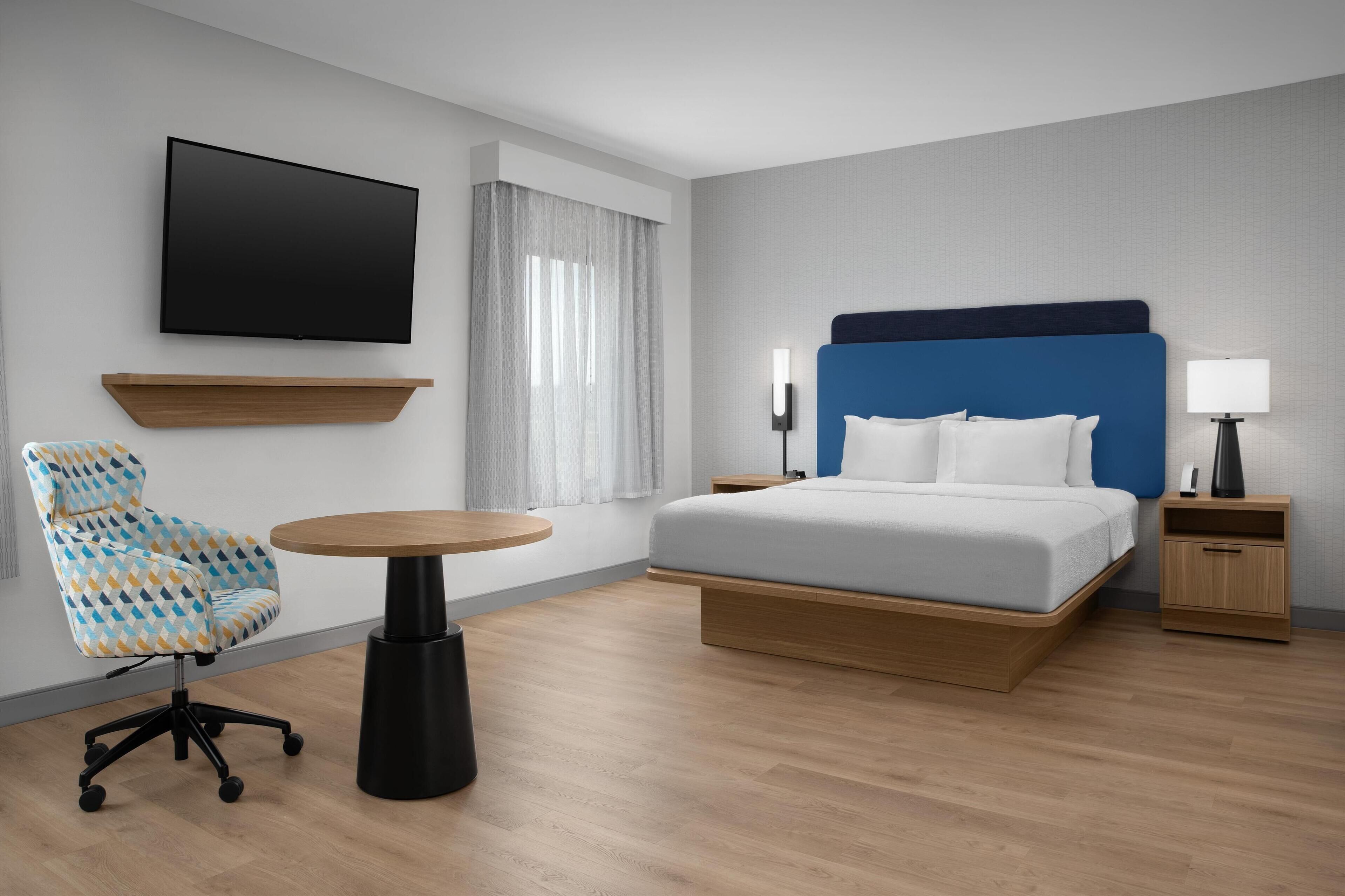 king studio suite | desk, laptop workspace, blackout curtains, iron/ironing board