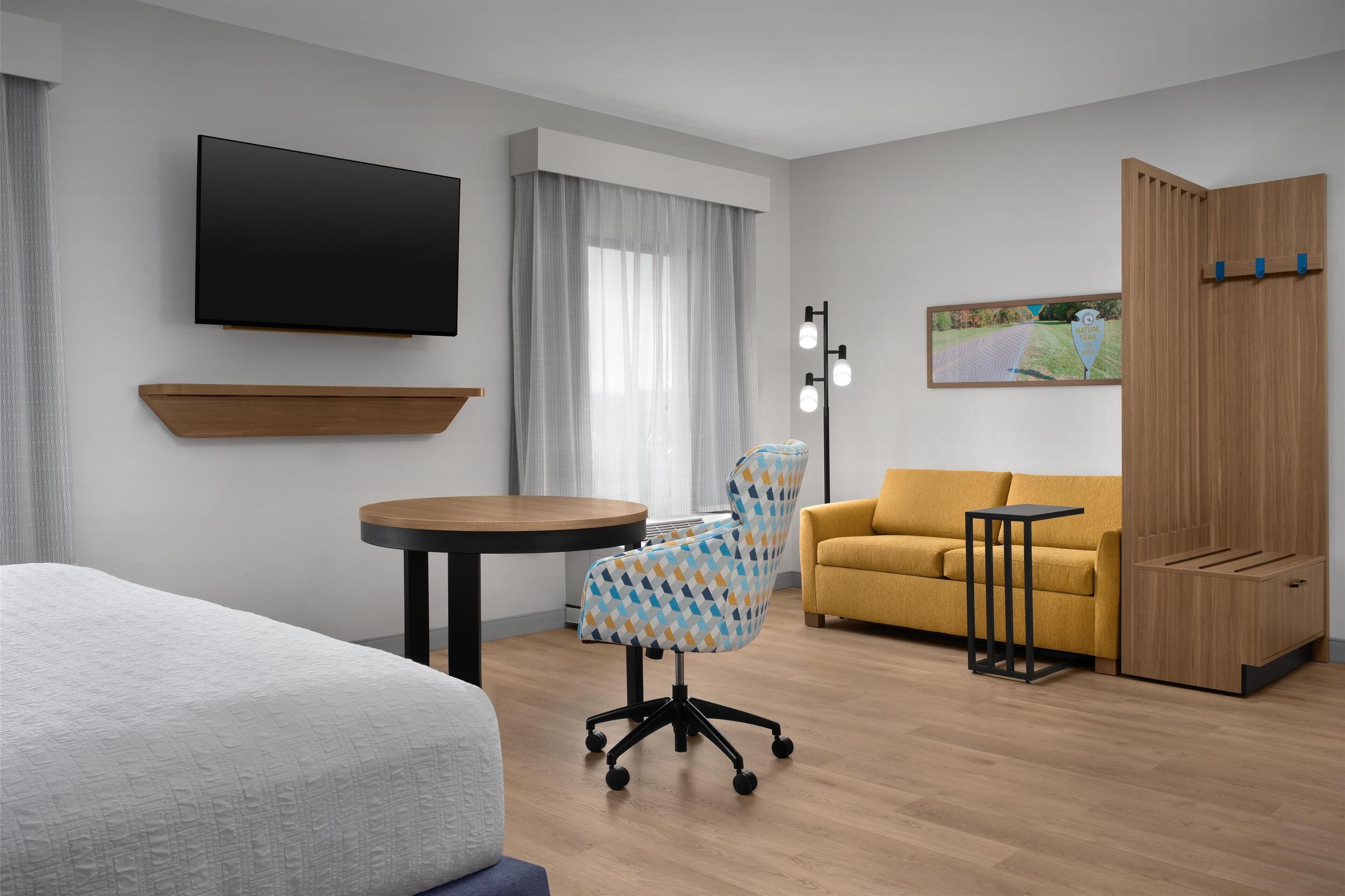 suite, 1 king bed, accessible, bathtub (mobility/hearing) | desk, laptop workspace, blackout curtains, iron/ironing board
