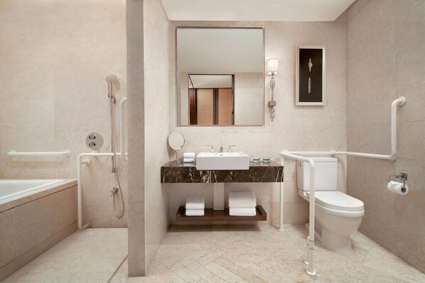 A modern bathroom with a bathtub, a sink, a toilet, and a shower. - Sheraton Xi'an North City Hotel (Xi'an)