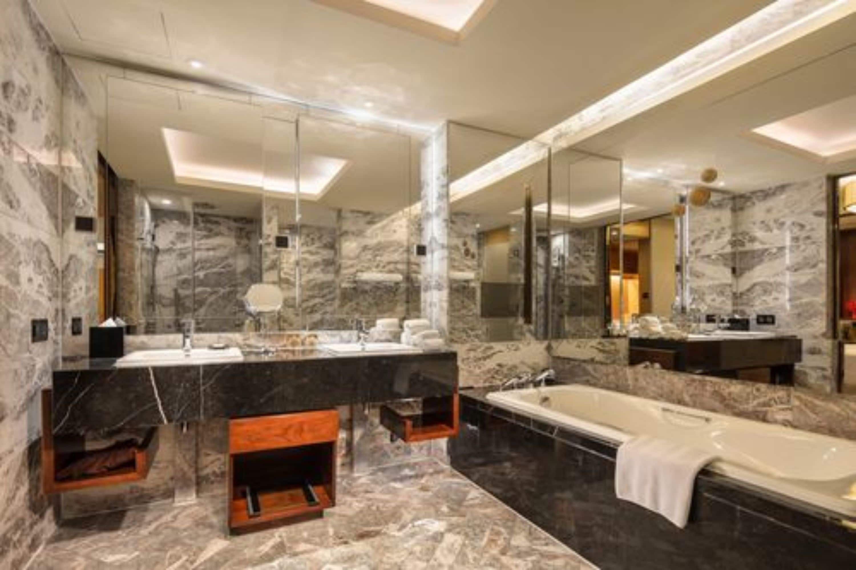 suite, 1 king bed, city view | bathroom | separate bathtub and shower, deep-soaking bathtub, free toiletries