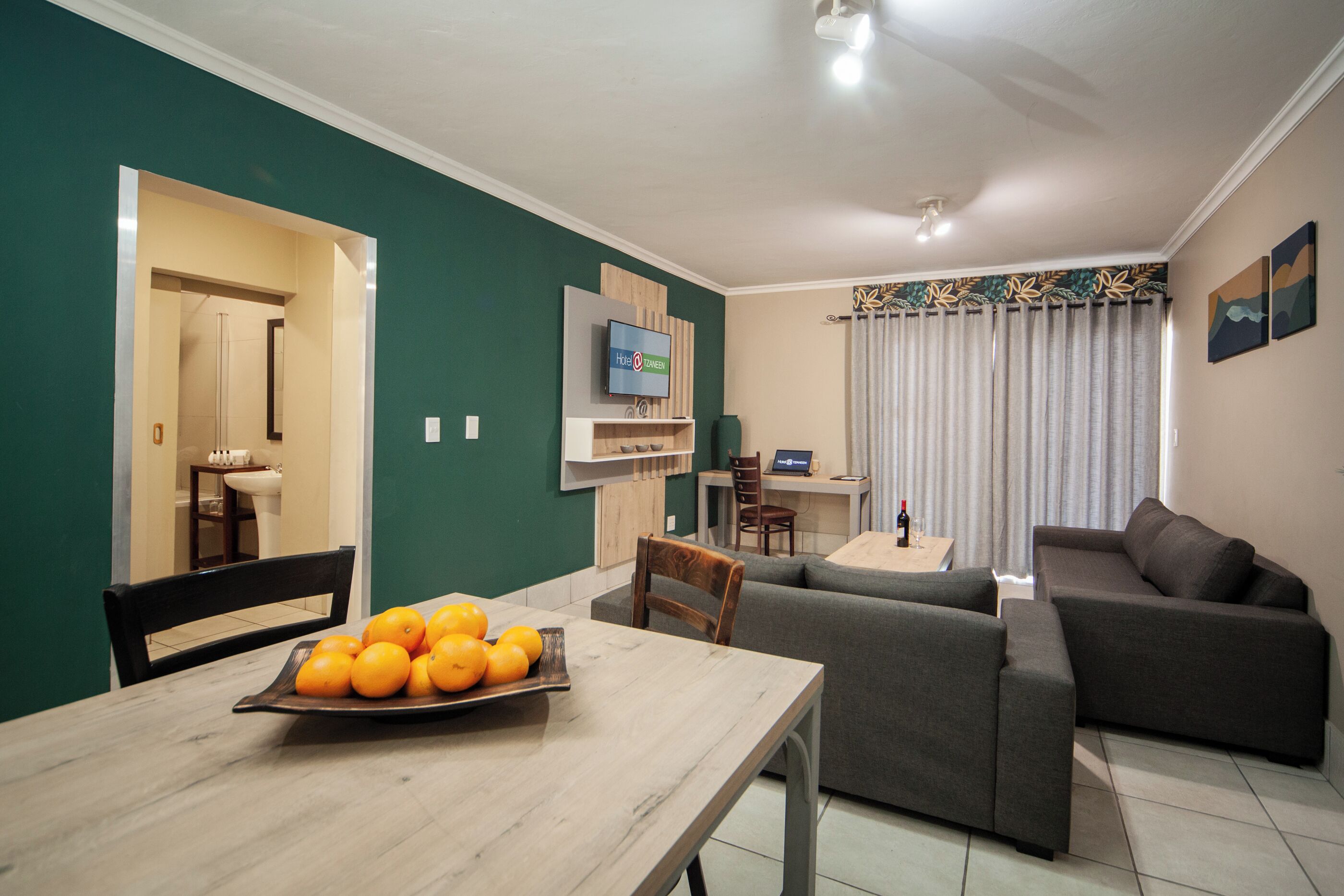 Family Suite | Living area | 32-cm LCD TV with satellite channels, TV