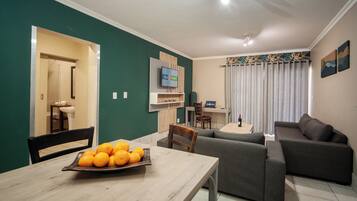 Family Suite | Living area | 32-cm LCD TV with satellite channels, TV