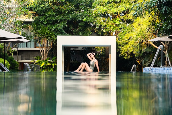 Outdoor pool, open 6:00 AM to 8:00 PM, pool umbrellas, pool loungers