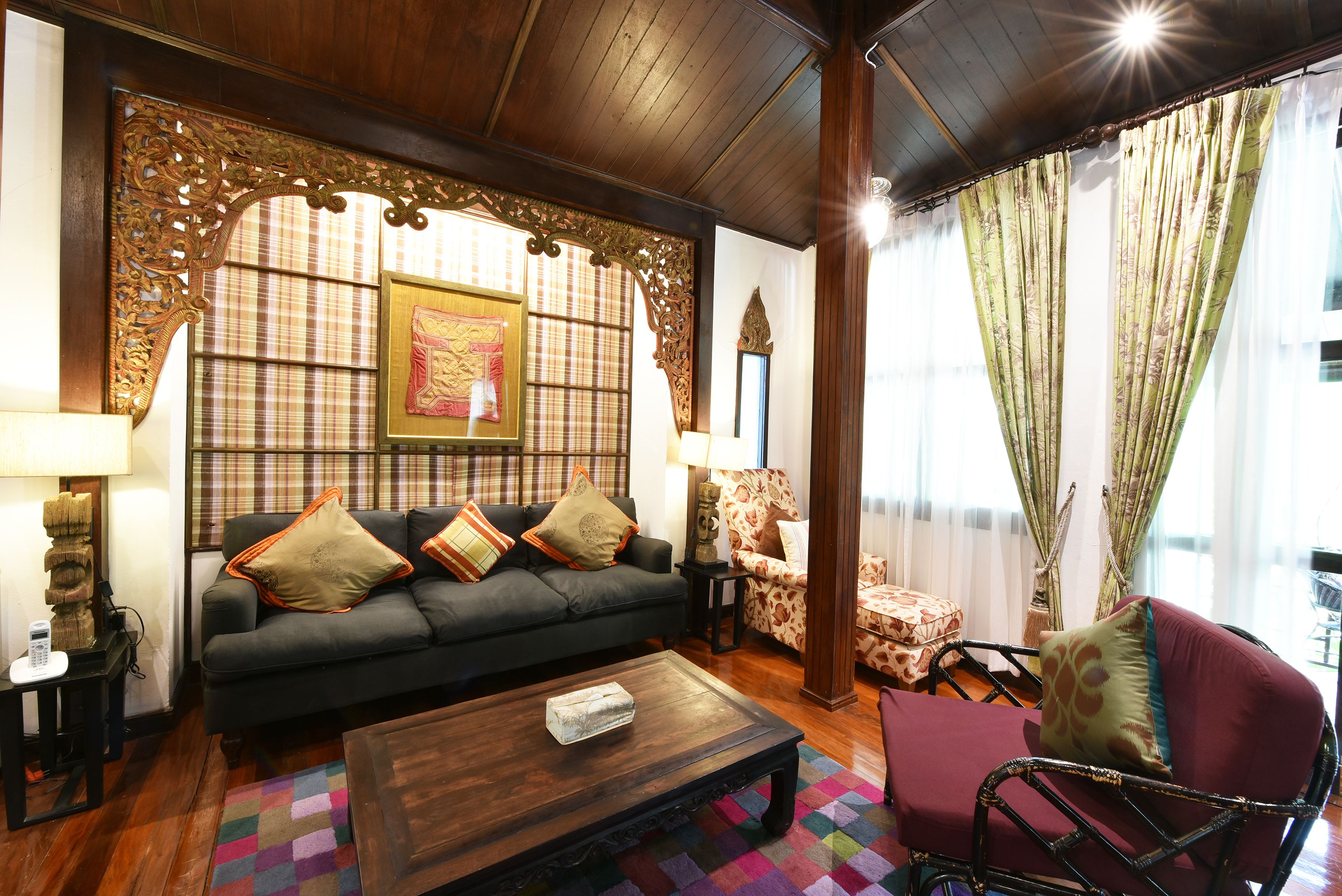 A living room with a sofa, armchair, and coffee table.