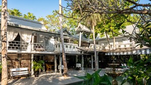 A traditional house with a pool, surrounded by tropical plants and trees. - Zantiis Ndol Villas (Muak Lek)