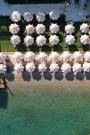 Playa privada, playa de arena blanca y traslado desde/hacia la playa