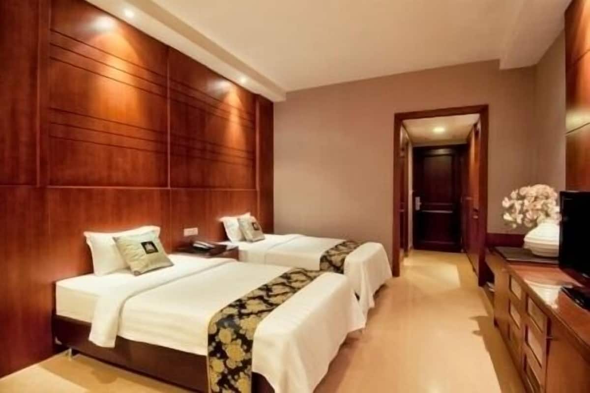 Executive | Een minibar, een kluis op de kamer, een bureau, extra bedden