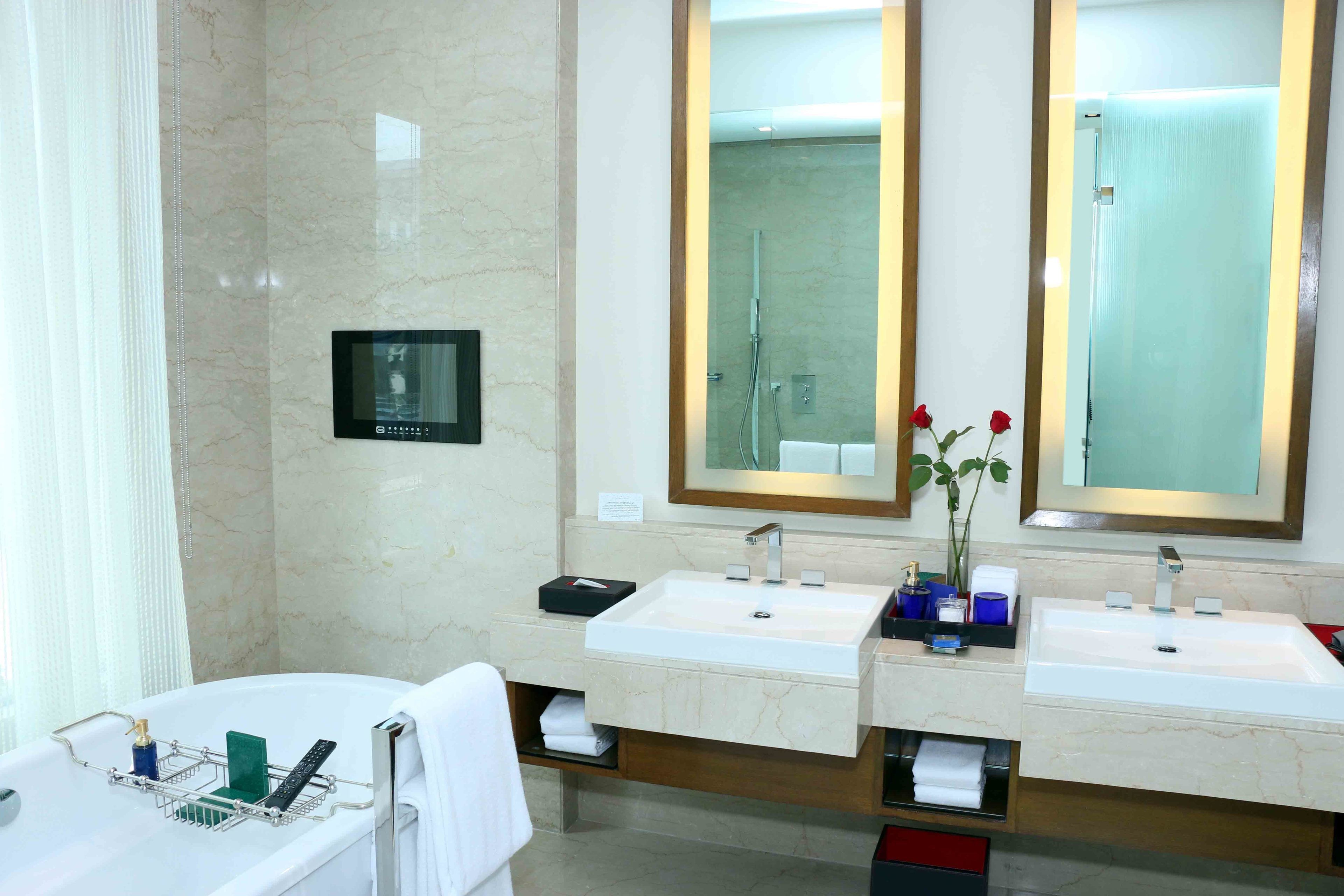 deluxe room | bathroom | separate bathtub and shower, deep-soaking bathtub, rainfall showerhead